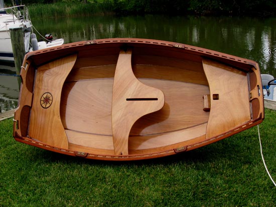 Stunningly varnished Eastport Pram with custom vinyl graphics.