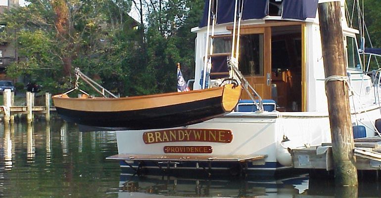 This Eastport Pram looks pretty sharp hanging from davits of the motor cruiser BRANDYWINE.