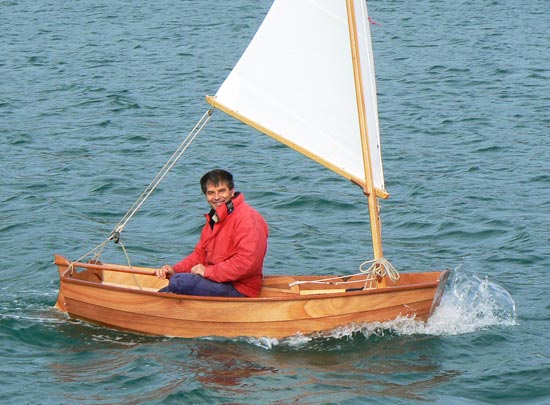 Lovely varnished hull on this Eastport Pram