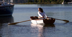 An Eastport Pram approaches her mothership. Thumbnail