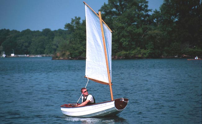 Though this scene is quiet, the Eastport Pram's high bow will deflect waves and surf to keep its passengers dry.