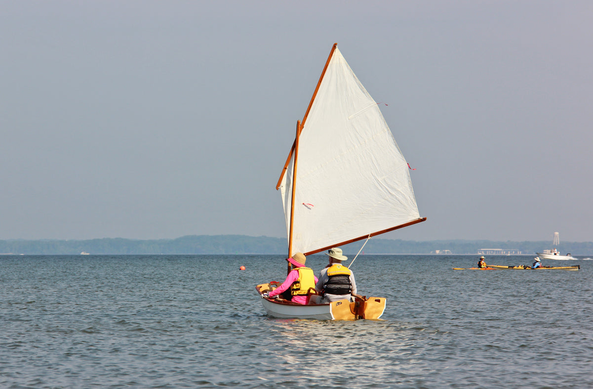 A couple enjoying a quiet sail at Okoumefest.