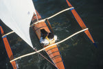 Overhead show of the CLC SailRig shows the orange sheet running along the port side of the kayak hull.  Thumbnail