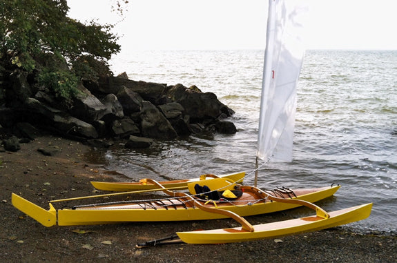 A Chesapeake 17 wooden kayak outfitted with a CLC sailrig, built by Troy M.