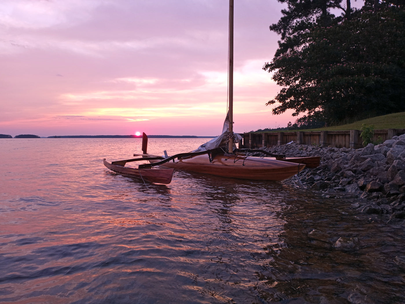 In Appling, Georgia, a kayak with a furled  CLC SailRig rests until the next sail over the lake.