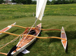 This picture shows how the sheet of the  CLC SailRig comes off the boom and aft to a block from which it runs forward to a block on the starboard side of the forward aka, and then can be controlled by the sailor.  Thumbnail
