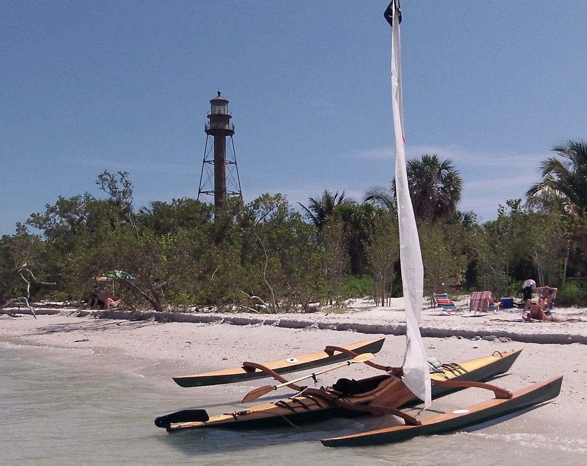 The leeboards are hauled up to be parallel to the main hull before beaching a kayak with a CLC SailRig.