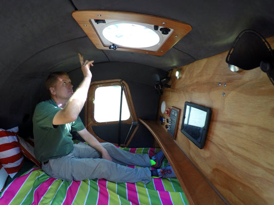 John Sitting up in the teardrop camper