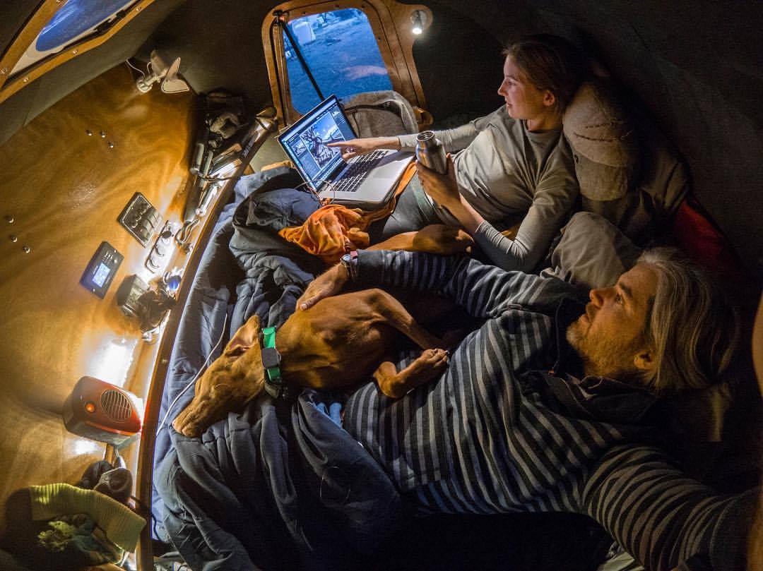 The Waterlust relaxes inside their CLC Teardrop Camper after a long day on the road.