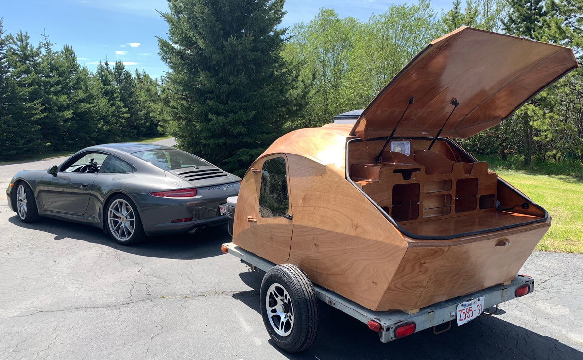 Gerald Wilkins pulls his CLC Teardrop Camper with his Porsche. 