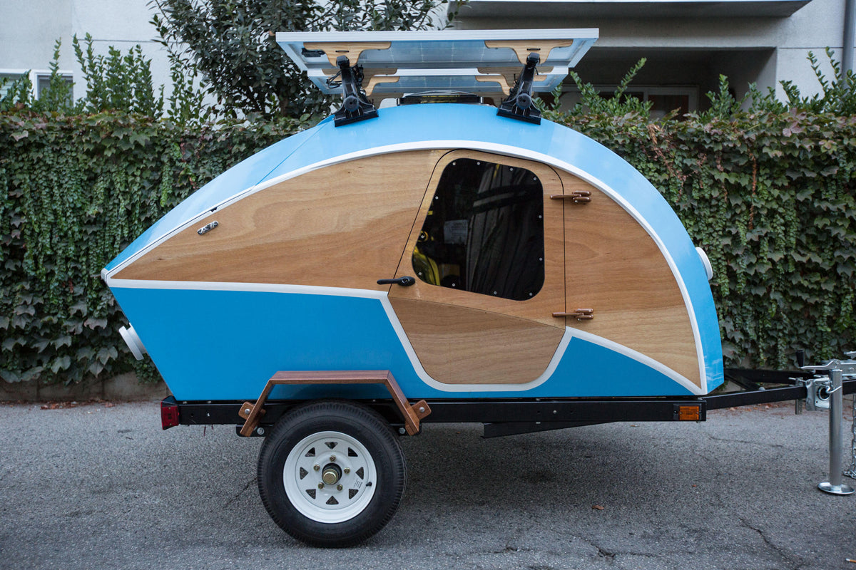 Brightly painted CLC Teardrop Camper with solar panels photographed by Zack Shepard.