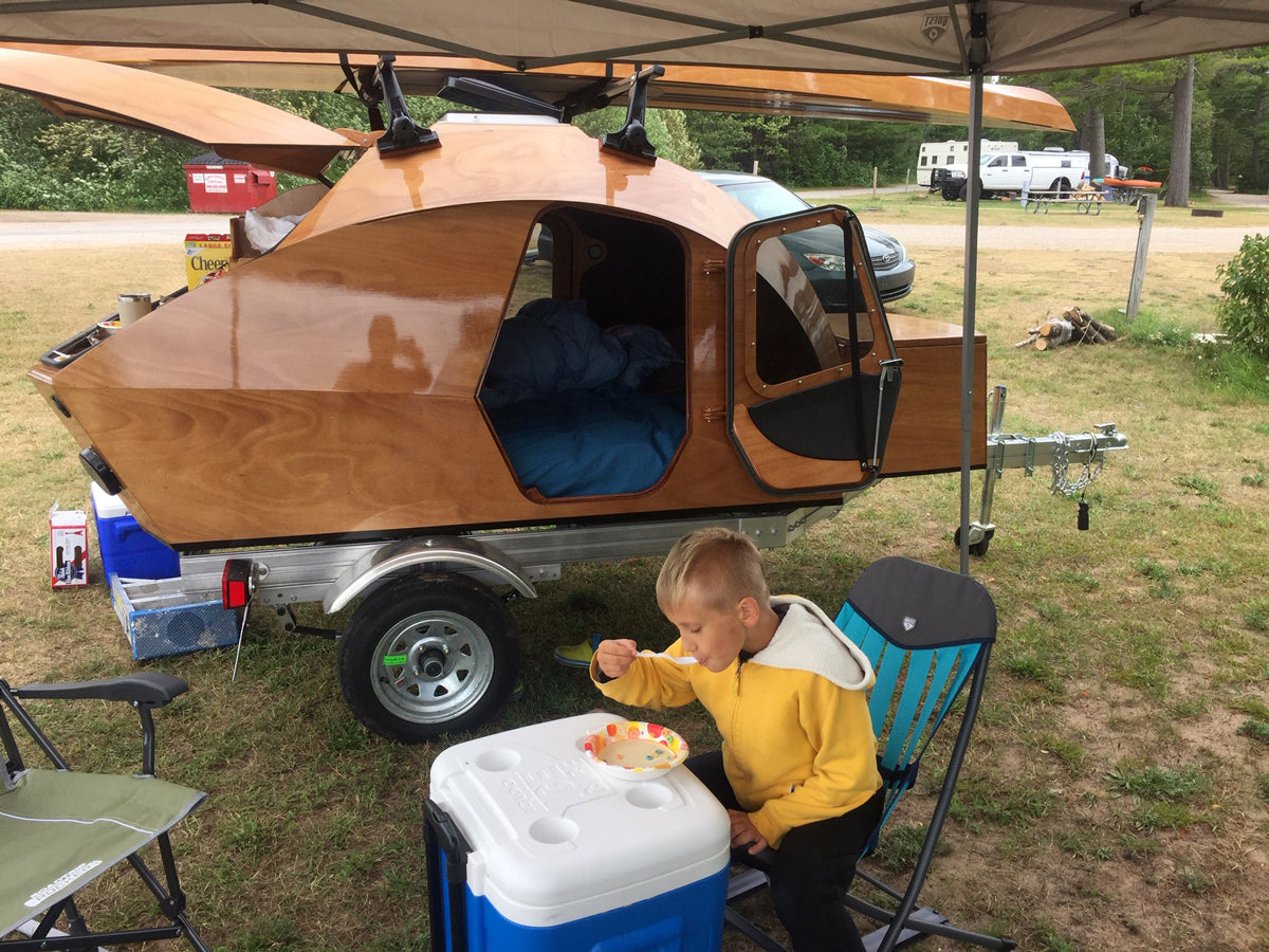 Breakfast at the campground in front of a CLC Teardrop Camper in Munising, Michigan.