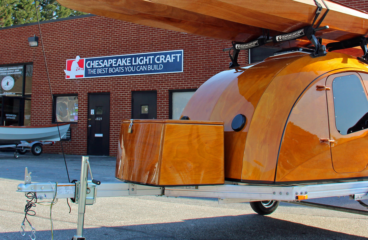 The storage box fits snugly on the customized trailer for the CLC Teardrop Camper, and it will hold a 48-quart cooler.
