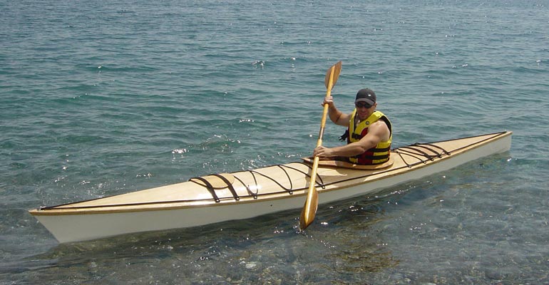 Alexandros M. paddling his Chesapeake 16 wooden kayak