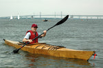 A young paddler testing out a Chesapeake 16 wooden kayak at OkoumeFest 2009 Thumbnail
