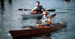 A woman paddling a Chesapeake 16 wooden kayak and a man in a Chesapeake 17LT kayak Thumbnail