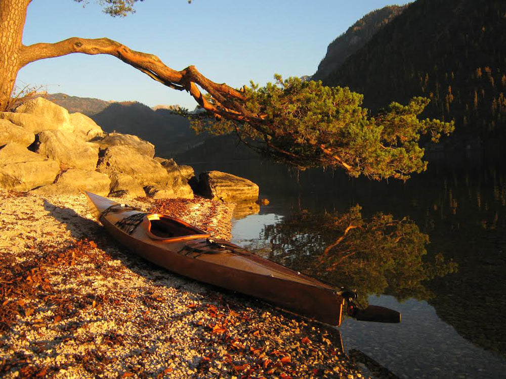 A Chesapeake 16 wooden kayak built by Peter and Minna S. on a beach in Poland