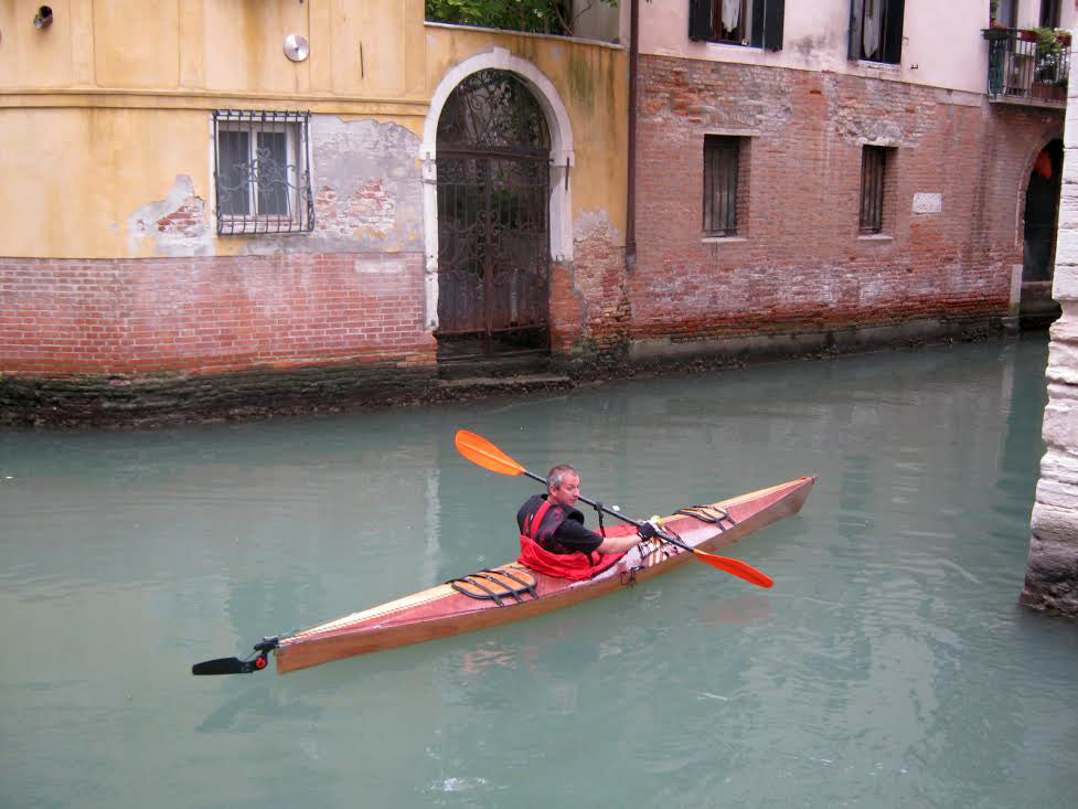 Paddling a Chesapeake 16 wooden kayak built by Peter and Minna S. on a canal in Venice, Italy. 