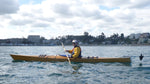 Arturo K. paddling his Chesapeake 16 wooden kayak with an electric trolling motor at the stern in Algarrobo Bay, Chile Thumbnail