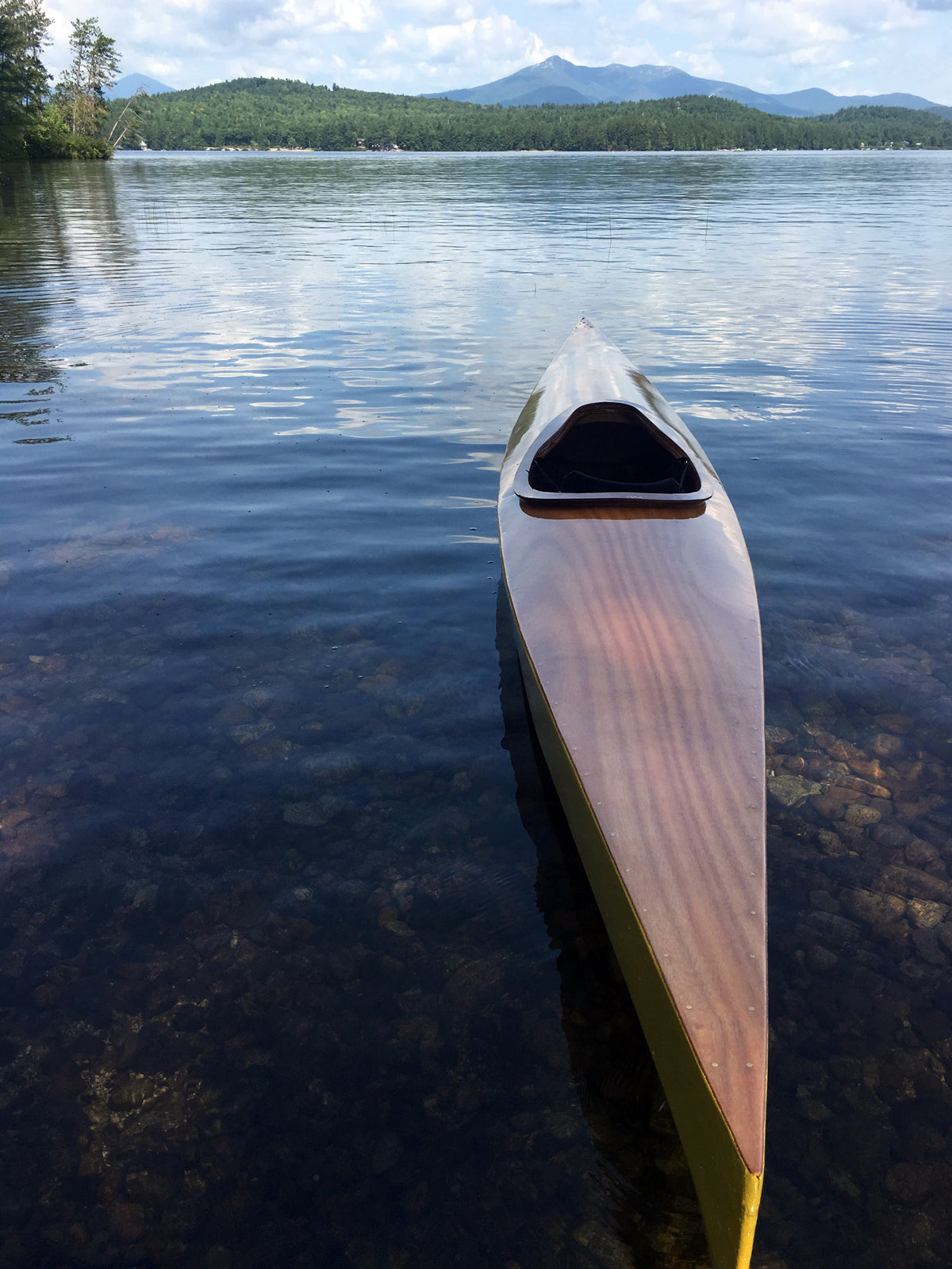 A newly finished Chesapeake 16 wooden kayak built by Mark T. on Silver Lake, Madison, NH
