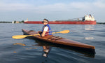 Kathleen C paddling on the St. Lawrence River in her Chesapeake 16 wooden kayak built by her husband, Timothy. Thumbnail