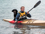Room for two. Sander S. and his dog, Kari, enjoy a paddle in Norway in his Chesapeake 16 wooden kayak Thumbnail