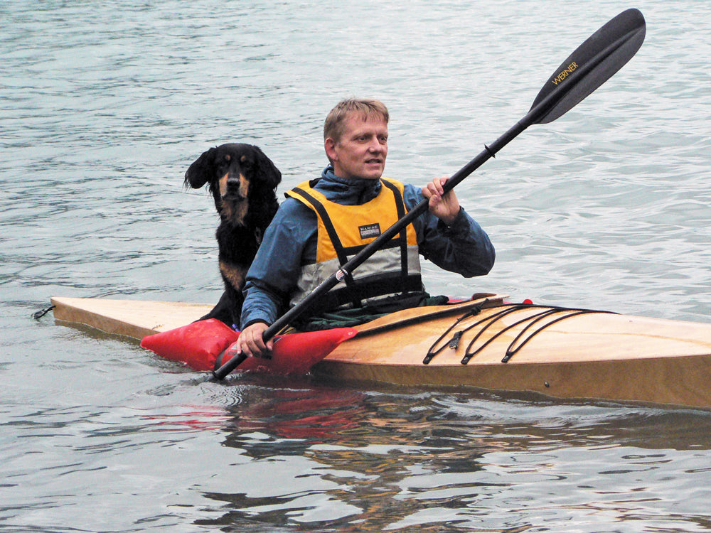 Room for two. Sander S. and his dog, Kari, enjoy a paddle in Norway in his Chesapeake 16 wooden kayak