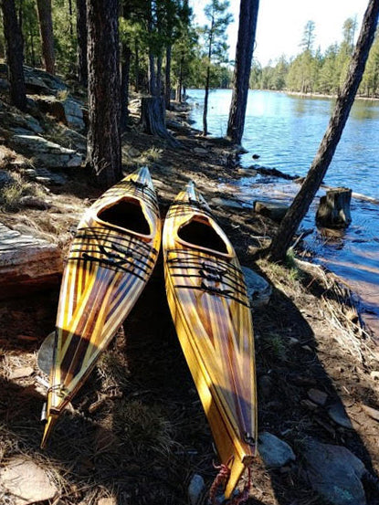A handsome pair of Chesapeake 16 wooden kayaks with strip-planked decks (hybrid), built by Tom W.