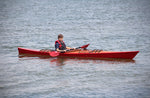 A youngster paddling a Chesapeake 16 wooden kayak at CLC's 2016 OkoumeFest  Thumbnail