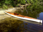 A white-hulled Chesapeake 17LT wooden kayak built by Mark N. on a Florida wetlands beach Thumbnail