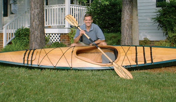 Sherman J showing off his Chesapeake 17LT wooden kayak on the lawn