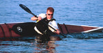A man bracing a Chesapeake 17LT wooden kayak Thumbnail
