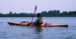 Paddling a Chesapeake 17LT wooden kayak on a peaceful river Thumbnail