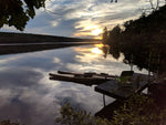 A sunset view over Lake Skatatuke, NH, of Chesapeake 17LT and 16LT wooden kayaks Thumbnail