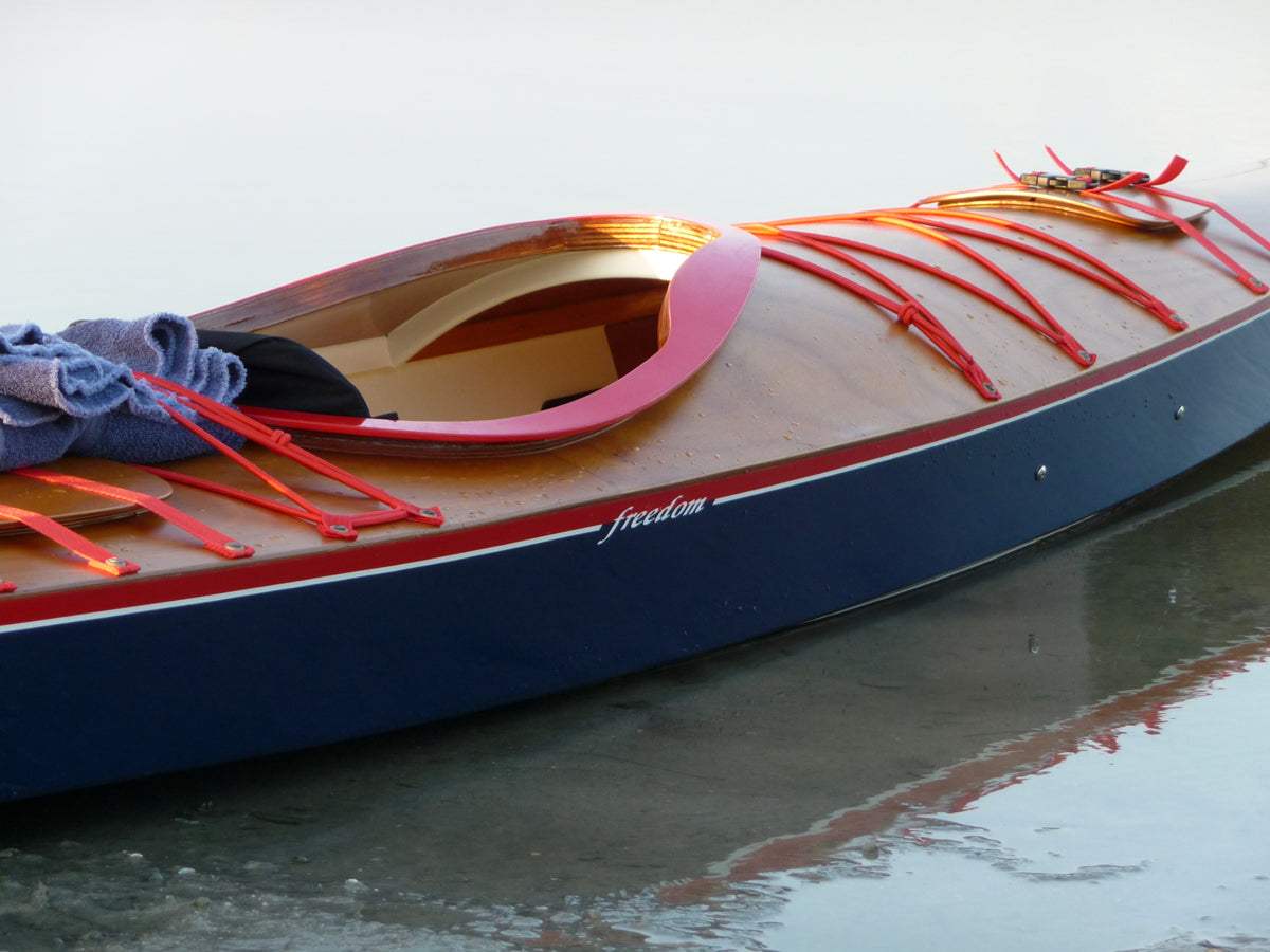 A close-up view of the cockpit area of a Chesapeake 17LT wooden kayak built by Jeff D.