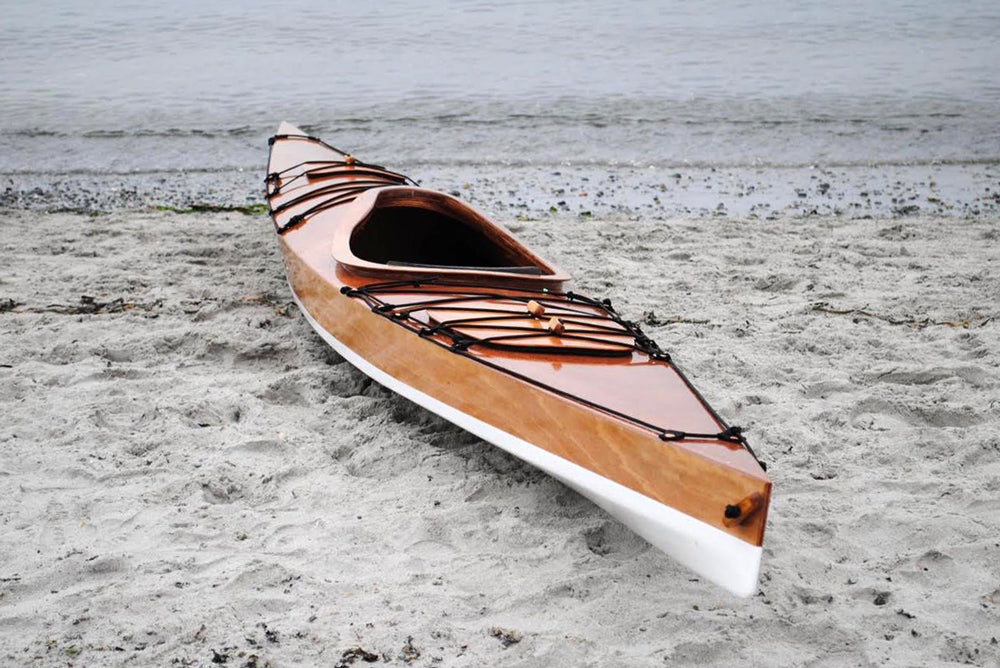 Reade J.' Chesapeake 17LT wooden kayak on a sandy beach in Victoria, BC
