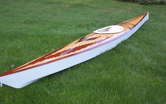 A hybrid Chesapeake 17 wooden kayak with strip-planked patterned deck