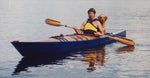 Christopher D. and his dog paddling his Chesapeake 17 wooden kayak Thumbnail