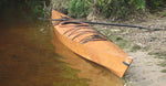 A wooden Chesapeake 17 kayak built by Paul J. at the water's edge Thumbnail
