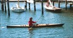 Paddling a Chesapeake 17 wooden kayak past a marina Thumbnail