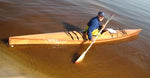 Klass J pushing off from the beach in his Chesapeake 17 wooden kayak Thumbnail
