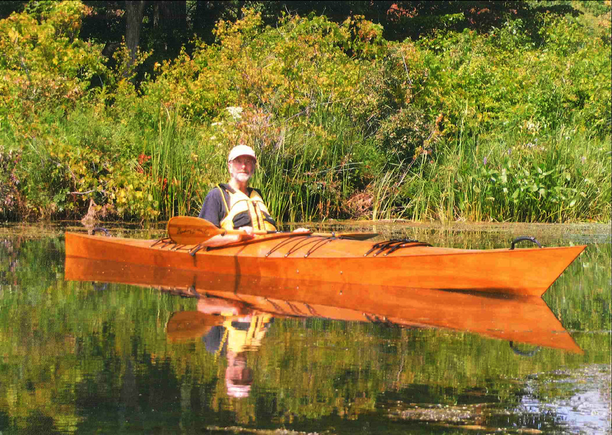 Christopher B. paddling his Chesapeake 17 wooden kayak in Presque Isle State Park
