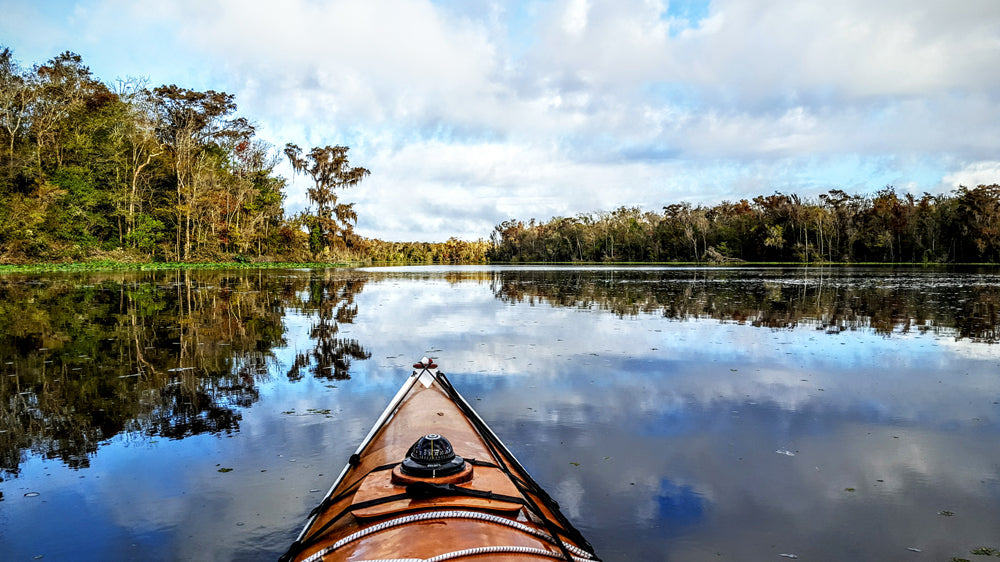 Looking over the bow of a Chesapeake 17 wooden kayak built by David B. on Black Creek in Florida