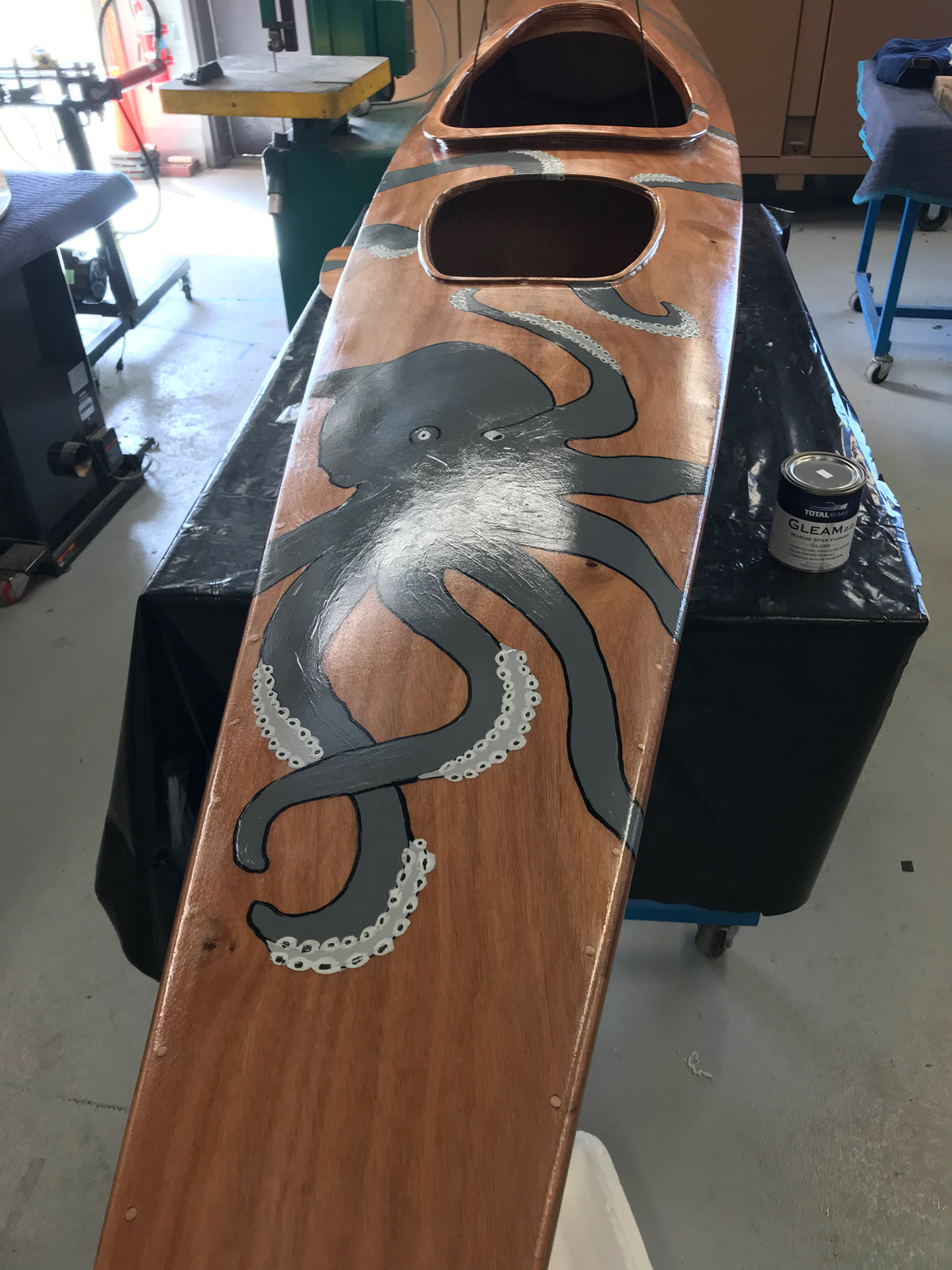 Fanciful graphics of an octopus on this nearly completed Chesapeake 17 wooden kayak built by Jerry J. in his workshop in Connecticut