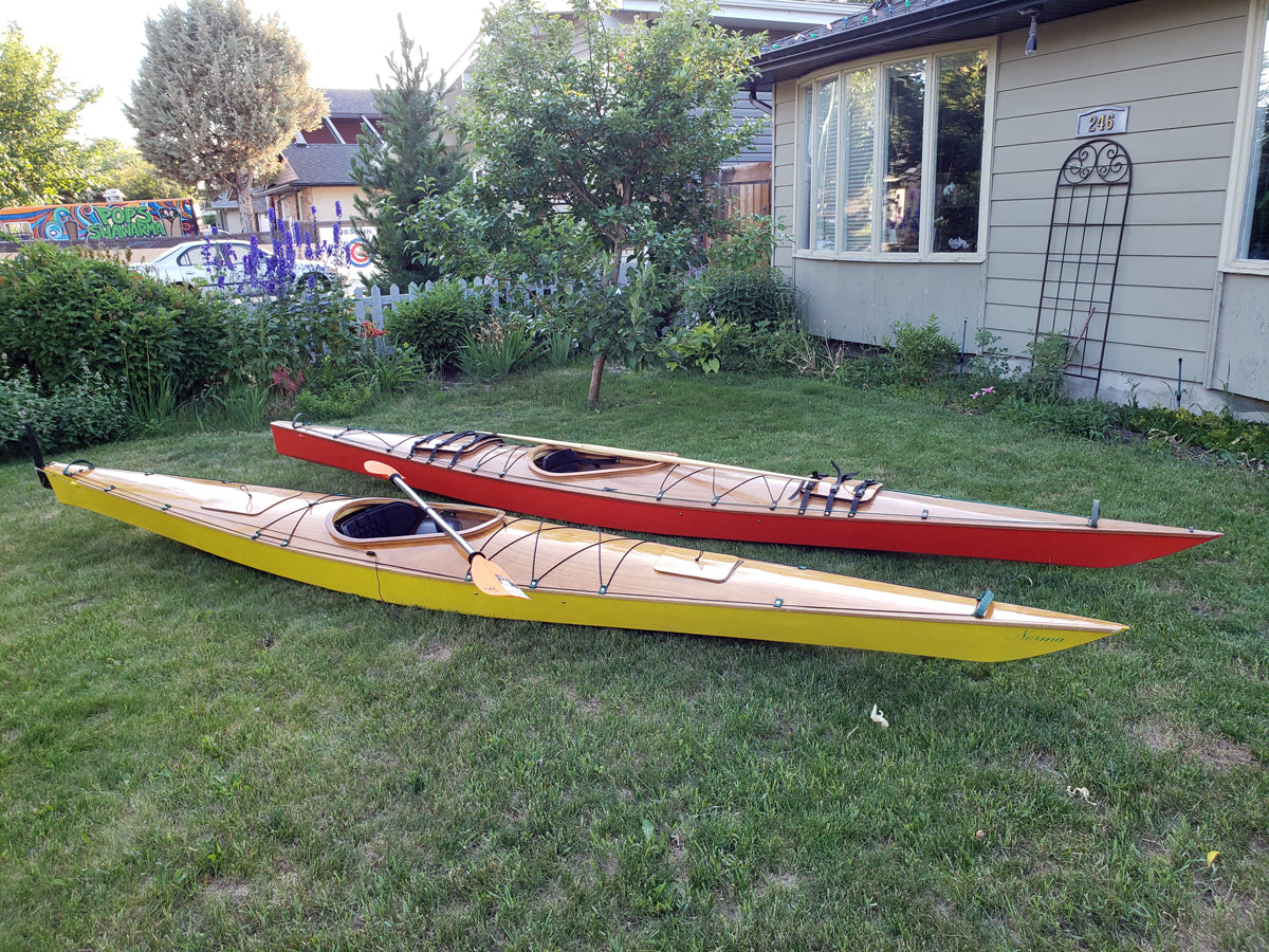 A pair of Chesapeake 17 wooden kayaks built from plans by Ken N