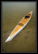 A Chesapeakle 17 wooden kayak built by Rich S. on a sandy shoreline Thumbnail