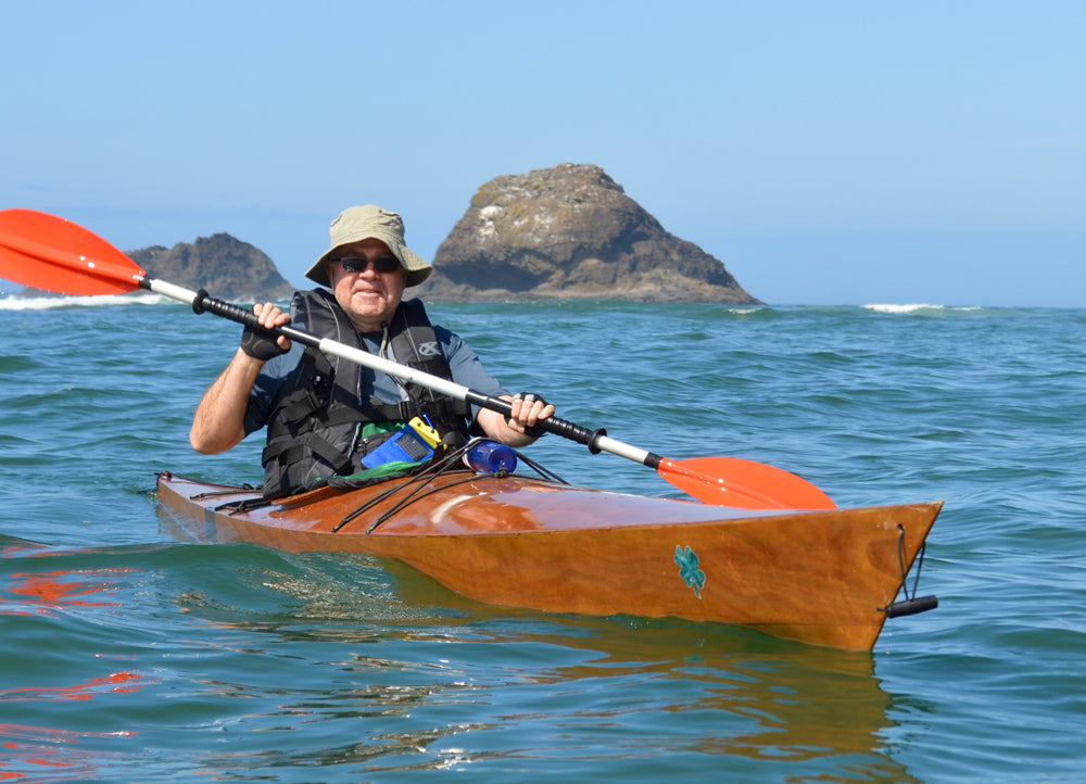 Steven R. enjoying a paddle in his Chesapeake 17 wooden kayak at Cascade Head on the Oregon Coast