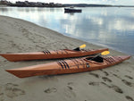 A pair of Chesapeake 17 wooden kayaks built by Mike D. on a sandy beach near Portland, Maine Thumbnail