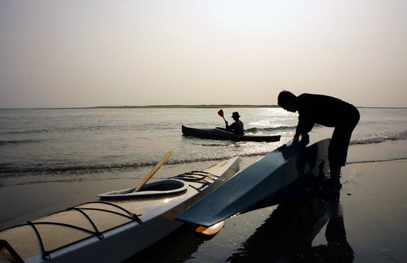 Launching Chesapeake 17 and Wood Duck 12 wooden kayaks built by Jung H. in Korea