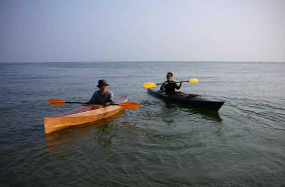 Paddling Chesapeake 17 (right) and Wood Duck 12 wooden kayaks built by Jung H. in Korea
